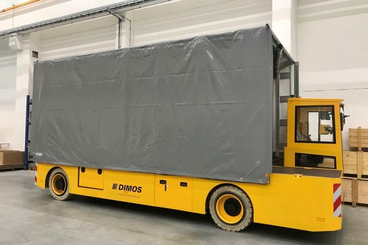 Platform truck with tarpaulin and cabin in side view of DIMOS